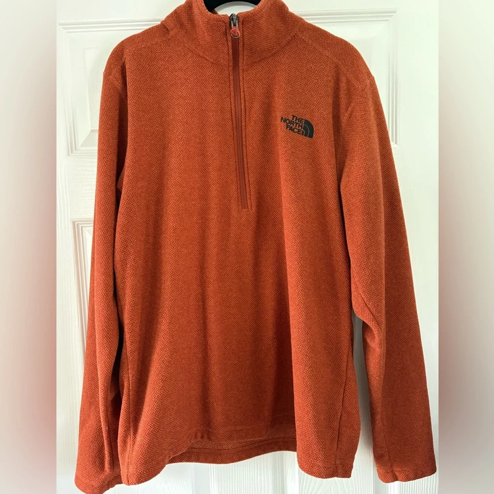 The North Face Textured Cap Rock Quarter Zip Pullover in a rust color